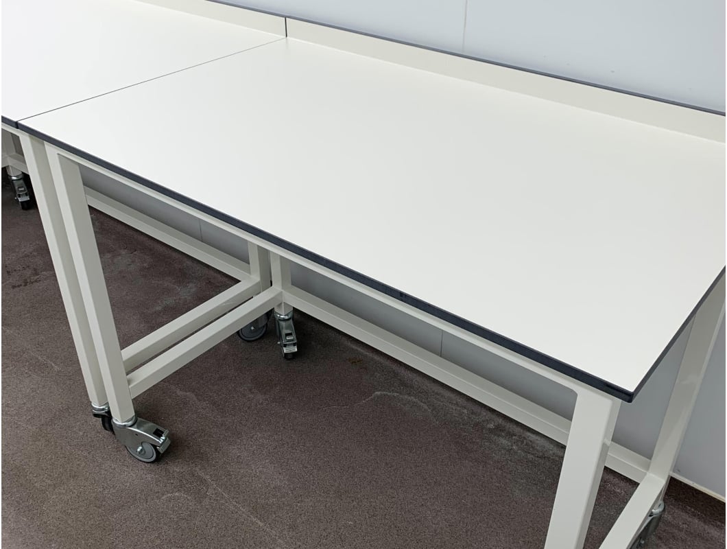 A white table with wheels.